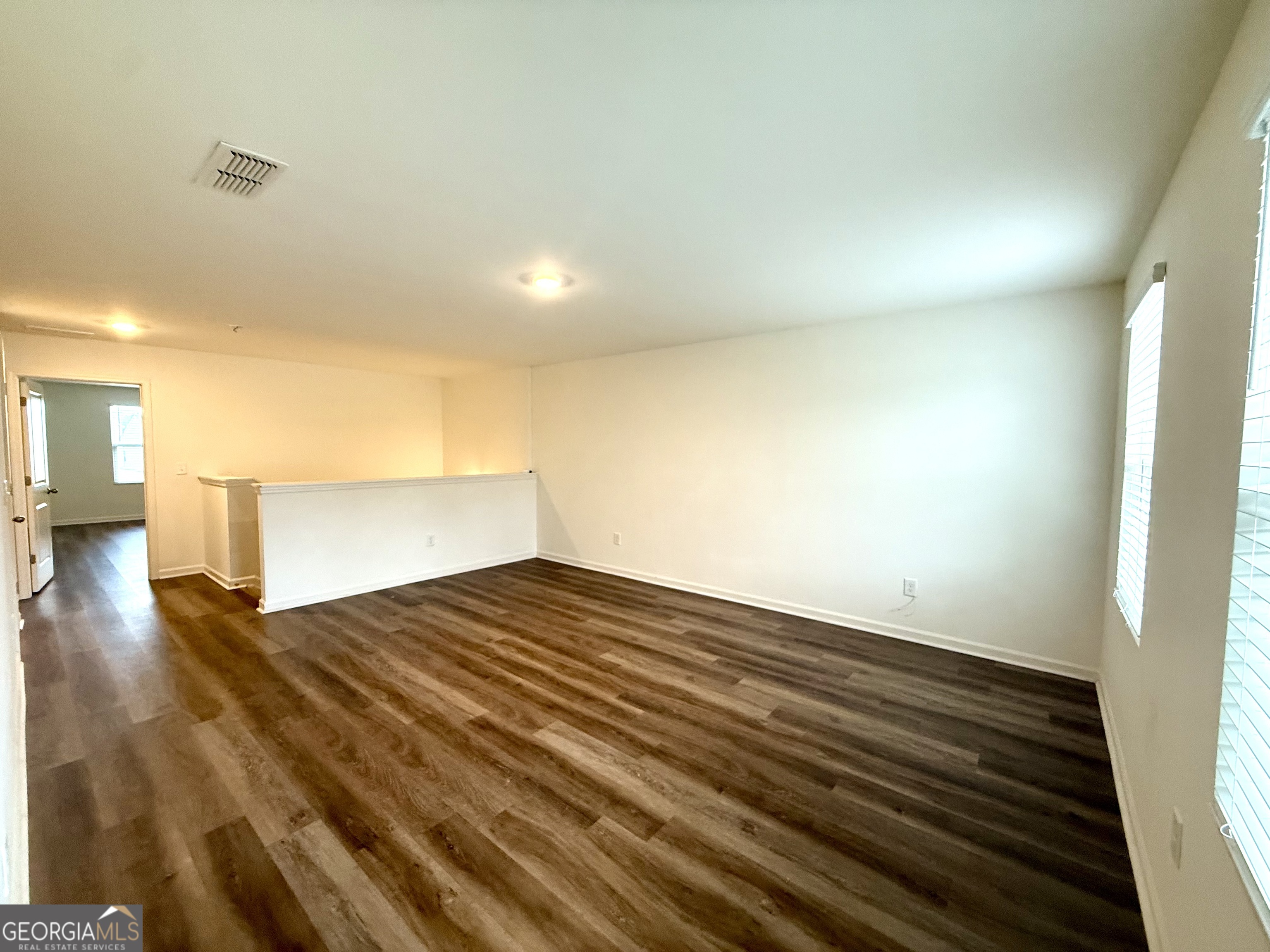 119 Pond Court Hoschton, GA 30548 - Photo 28 of 29 a view of empty room with wooden floor