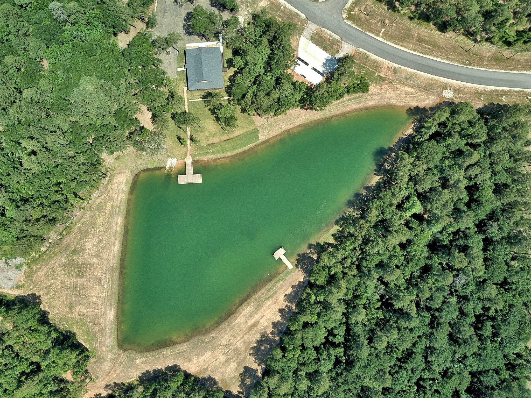 258 Heartland Road New Waverly, TX 77358 - Photo 9 of 27 Community Pond Aerial View