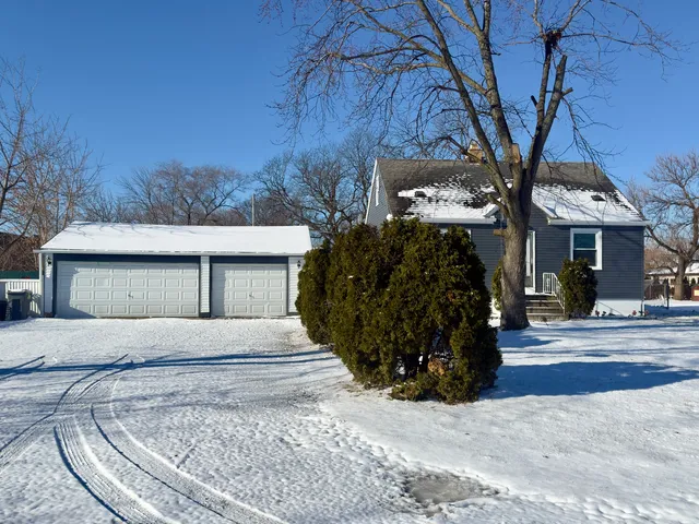 a view of a house with a tree