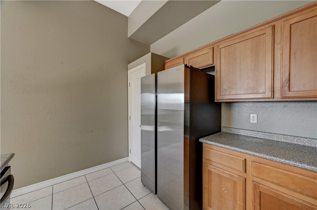 8985 South Durango Drive, Unit 2187 Las Vegas, NV 89113 - Photo 27 of 73 Functional kitchen with ample cabinet space, durable countertops, and sleek appliances.