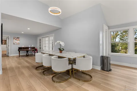 a living room with furniture a window and a table