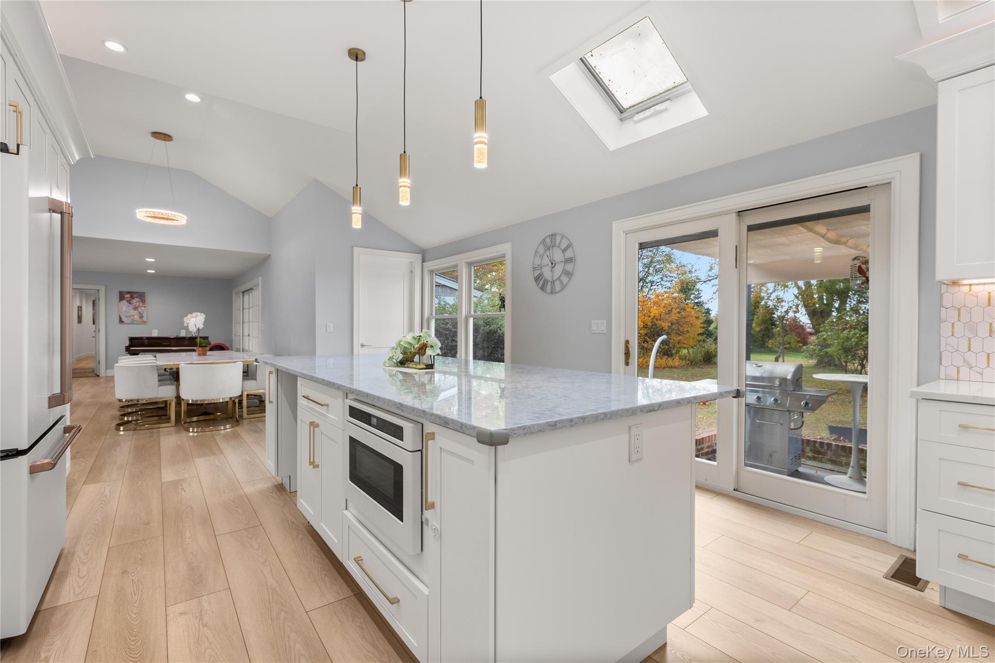 272 Ocean Avenue Islip, NY 11751 - Photo 14 of 39 a kitchen with stainless steel appliances granite countertop a stove and a wooden floors