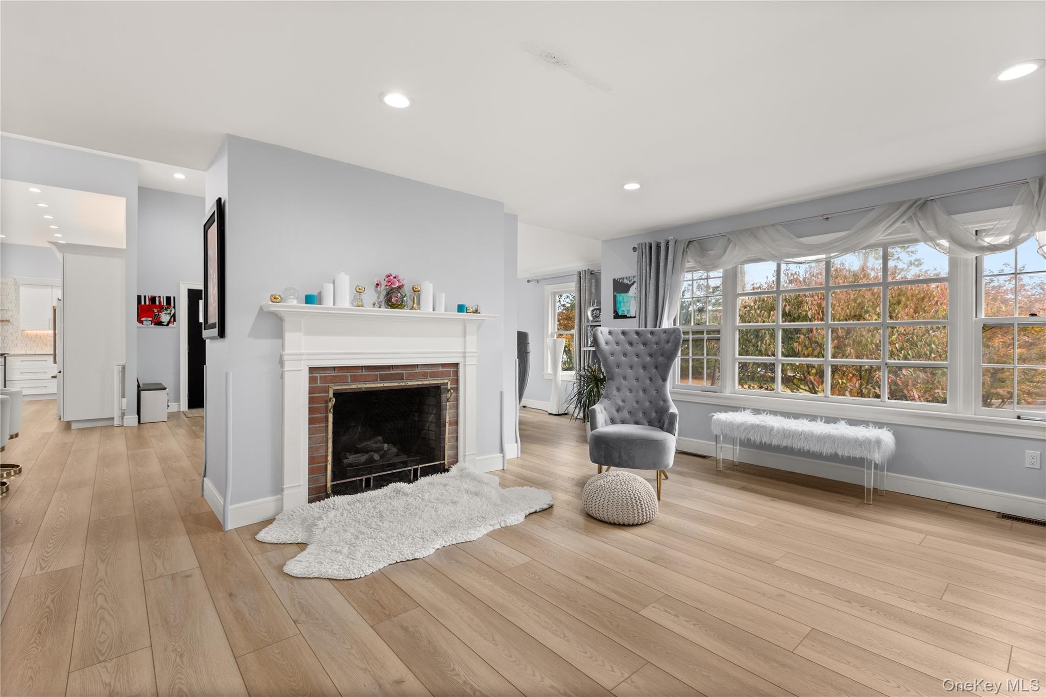 272 Ocean Avenue Islip, NY 11751 - Photo 16 of 39 a living room with furniture and a fireplace