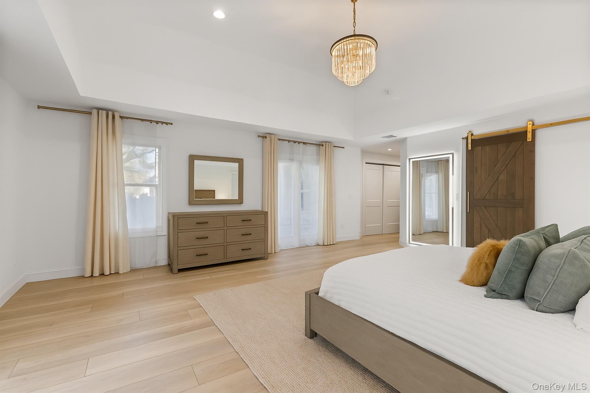 272 Ocean Avenue Islip, NY 11751 - Photo 18 of 39 a bedroom with a large bed and a window