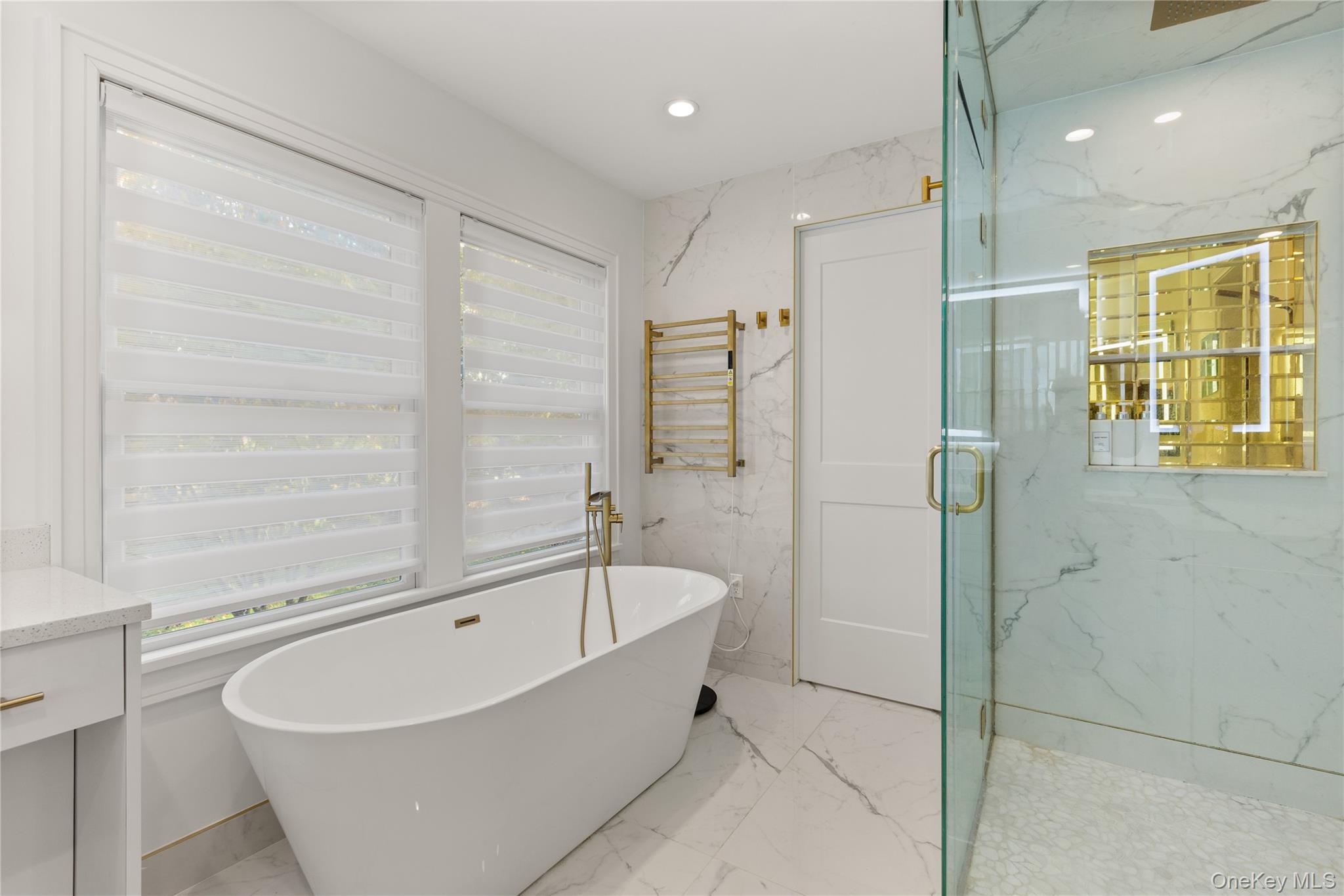 272 Ocean Avenue Islip, NY 11751 - Photo 20 of 39 a bathroom with a bathtub and a shower