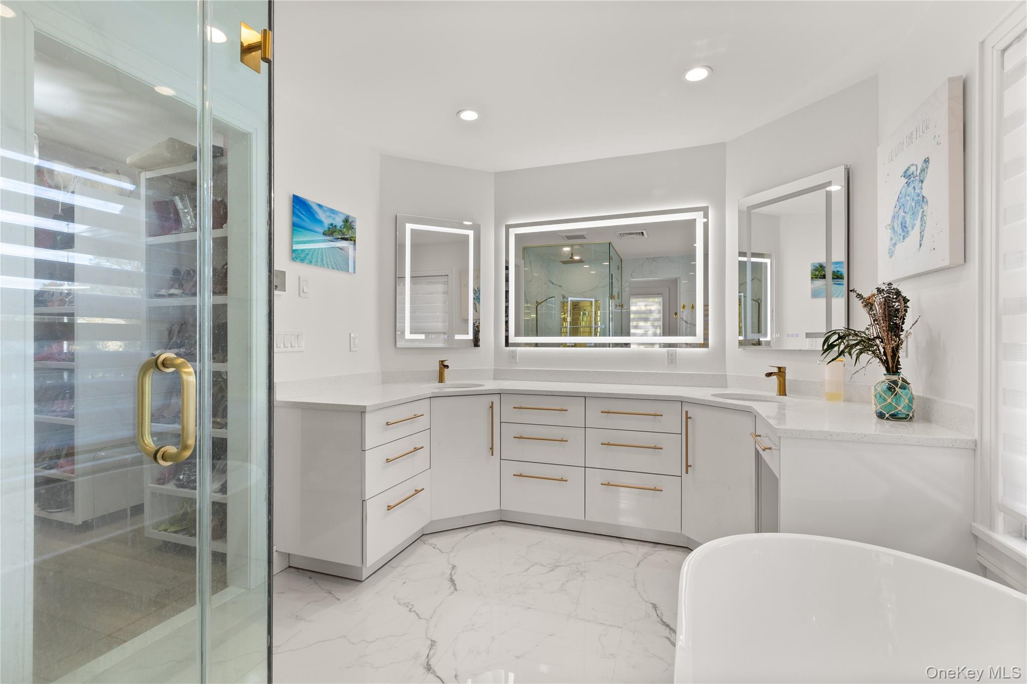 272 Ocean Avenue Islip, NY 11751 - Photo 21 of 39 a spacious bathroom with a granite countertop sink a toilet a mirror and shower