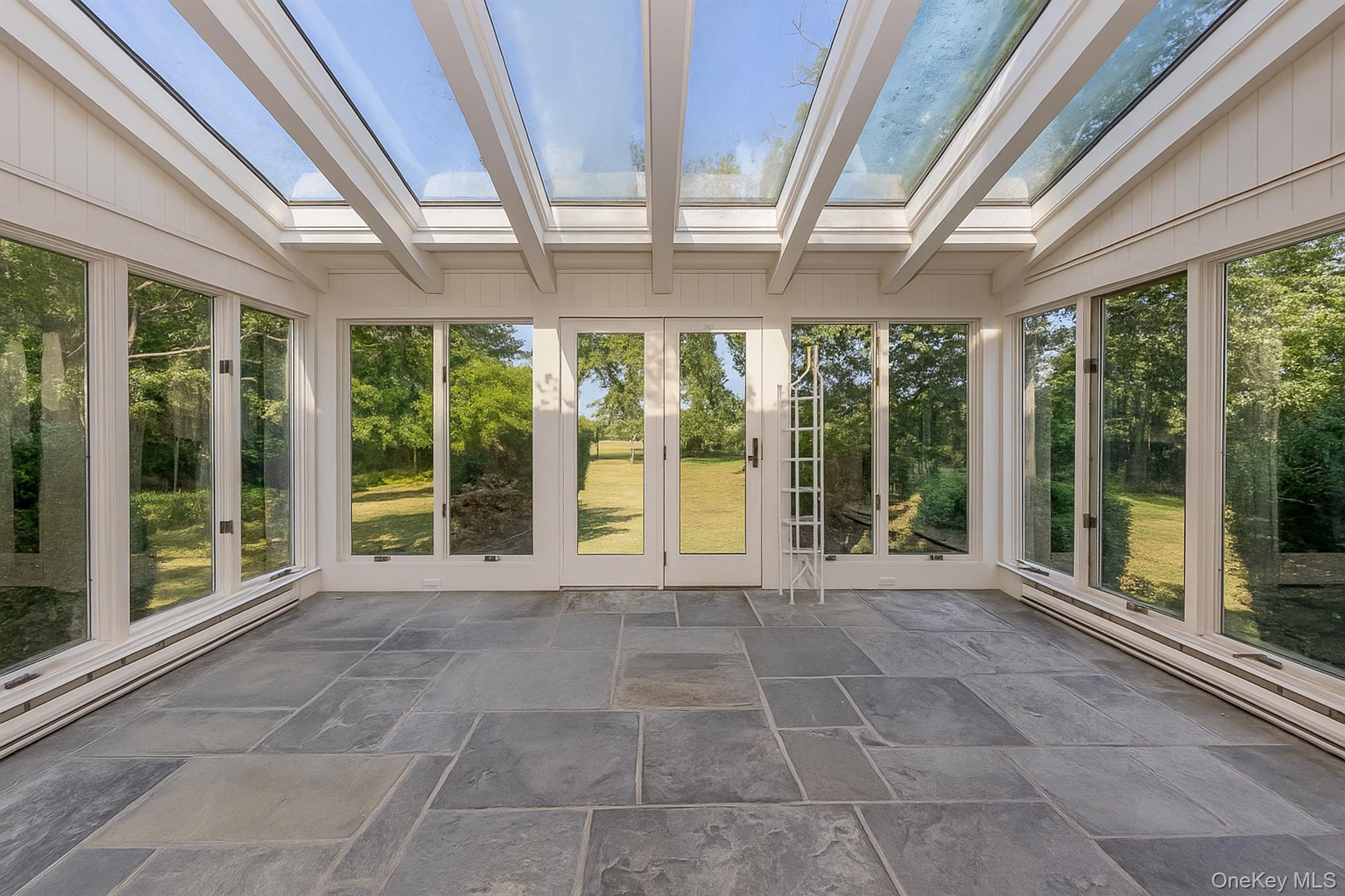 272 Ocean Avenue Islip, NY 11751 - Photo 25 of 39 a view of an empty room with windows and balcony