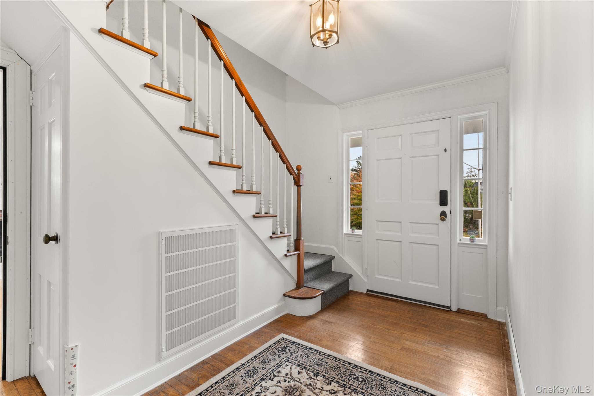 272 Ocean Avenue Islip, NY 11751 - Photo 27 of 39 a view of entryway with wooden floor and stairs