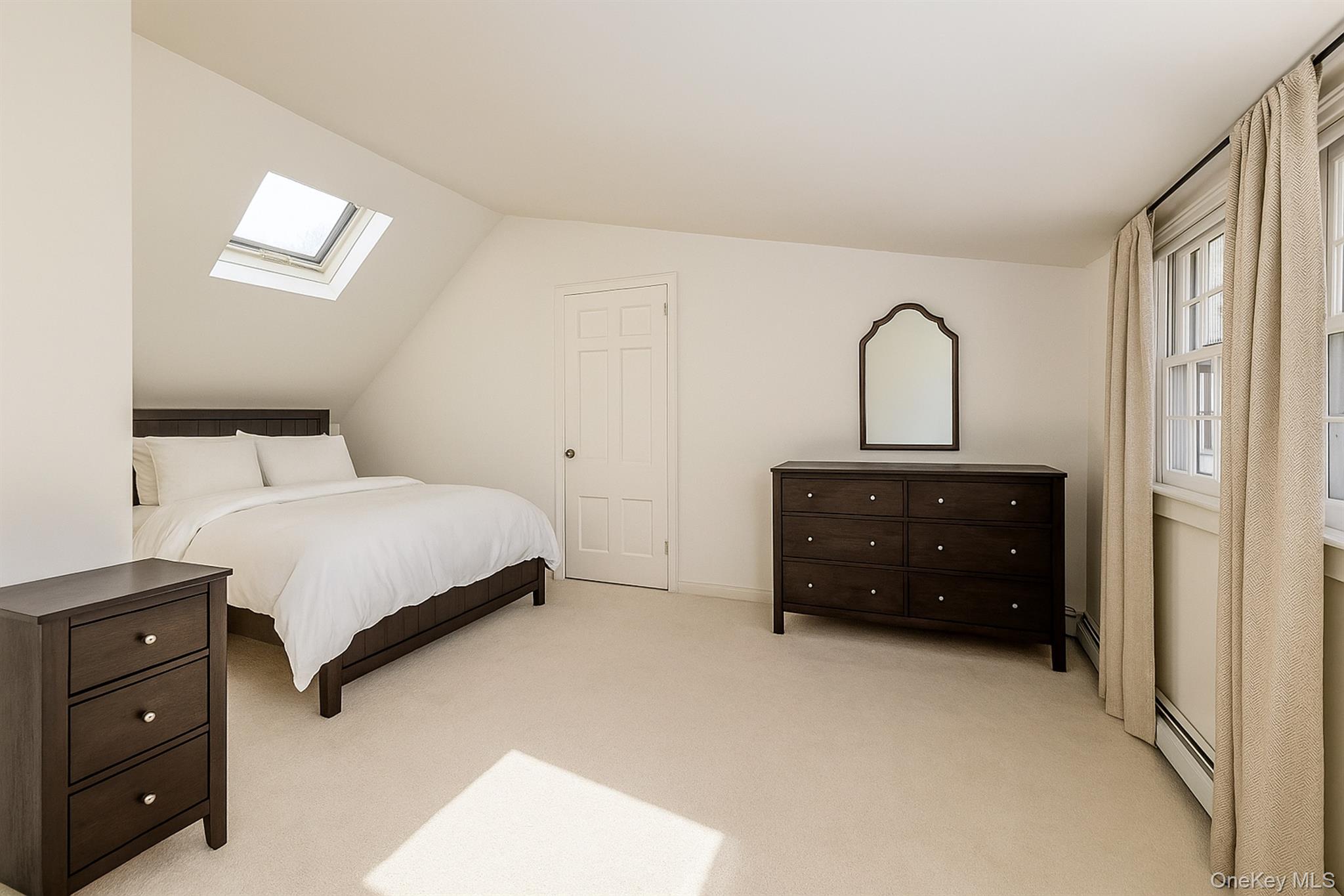 272 Ocean Avenue Islip, NY 11751 - Photo 29 of 39 a bedroom with a bed and a dresser