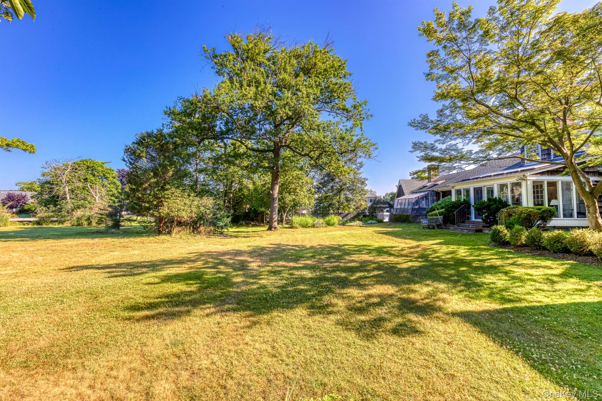 272 Ocean Avenue Islip, NY 11751 - Photo 30 of 39 a view of an ocean with a house in the background