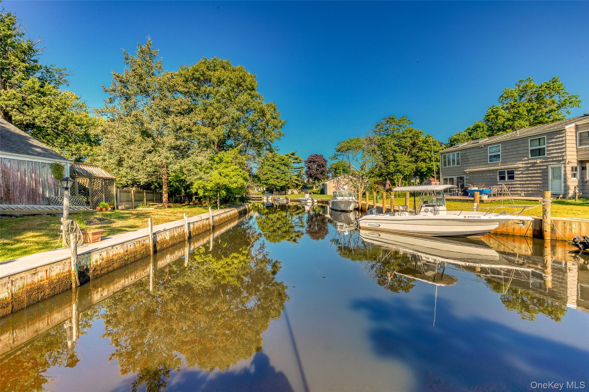 272 Ocean Avenue Islip, NY 11751 - Photo 4 of 39 a view of a swimming pool with an outdoor seating