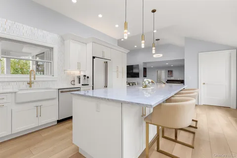 a kitchen with counter space a sink and appliances