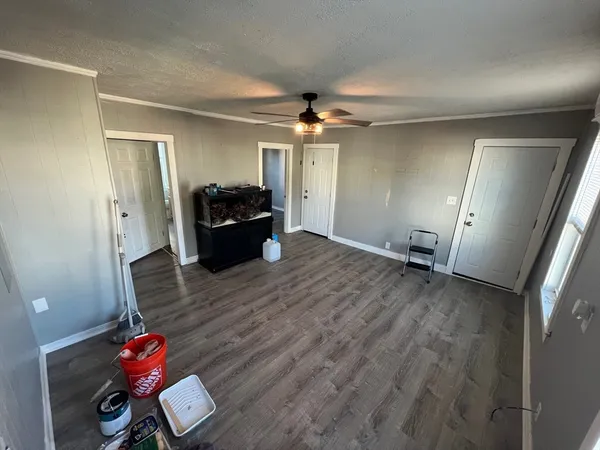 a view of an entryway with wooden floor