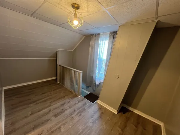 a view of entryway with wooden floor
