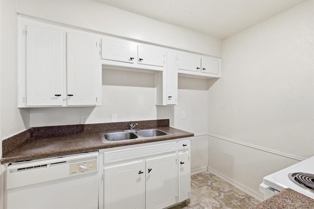 756 East Pecan Street Hurst, TX 76053 - Photo 13 of 19 a kitchen with a sink and cabinets