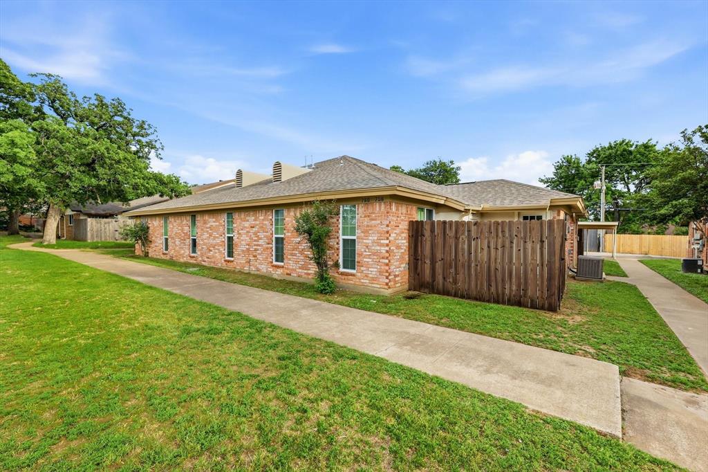 756 East Pecan Street Hurst, TX 76053 - Photo 3 of 19 a front view of a house with yard porch and green space