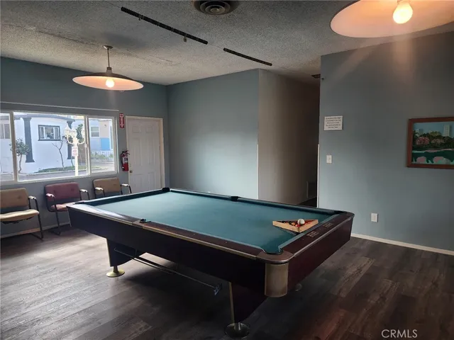 a bedroom with a bed closet and a large window