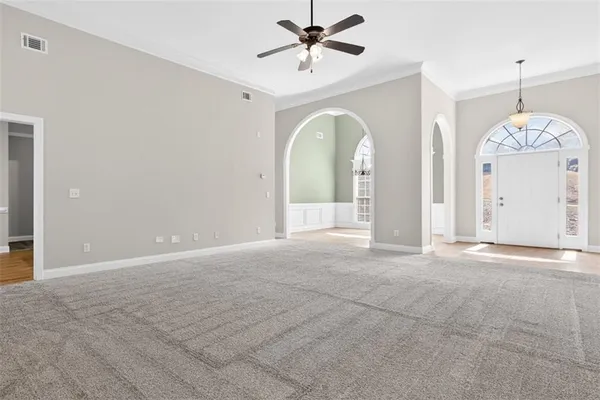a view of an empty room with a window