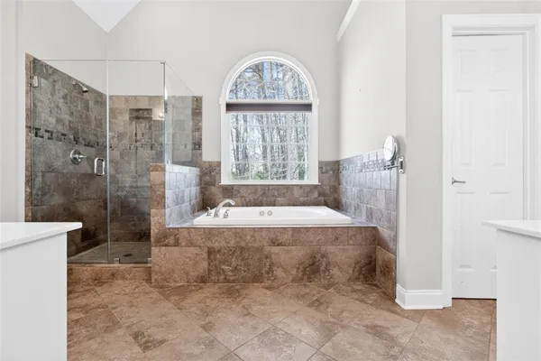 a bathroom with a double vanity sink mirror and
