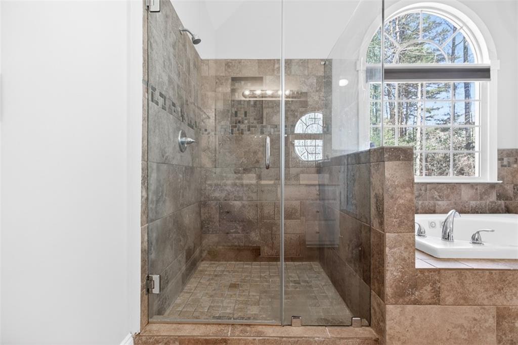 3570 Bulloch Lake Road Loganville, GA 30052 - Photo 24 of 71 a bathroom with a shower