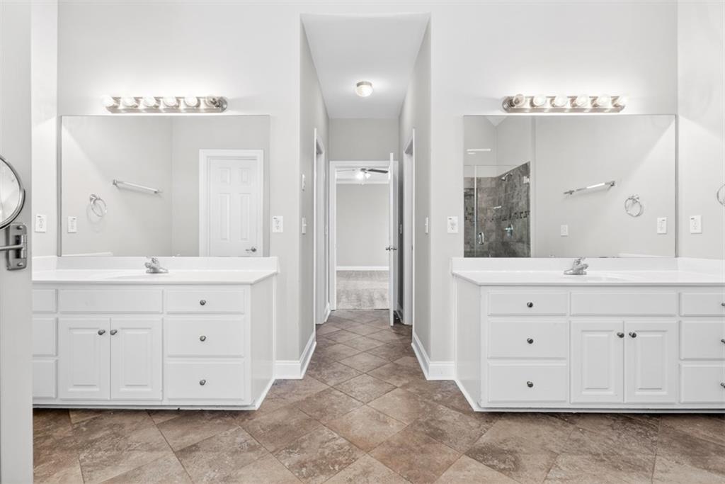 3570 Bulloch Lake Road Loganville, GA 30052 - Photo 26 of 71 a bathroom with a double vanity sink mirror and