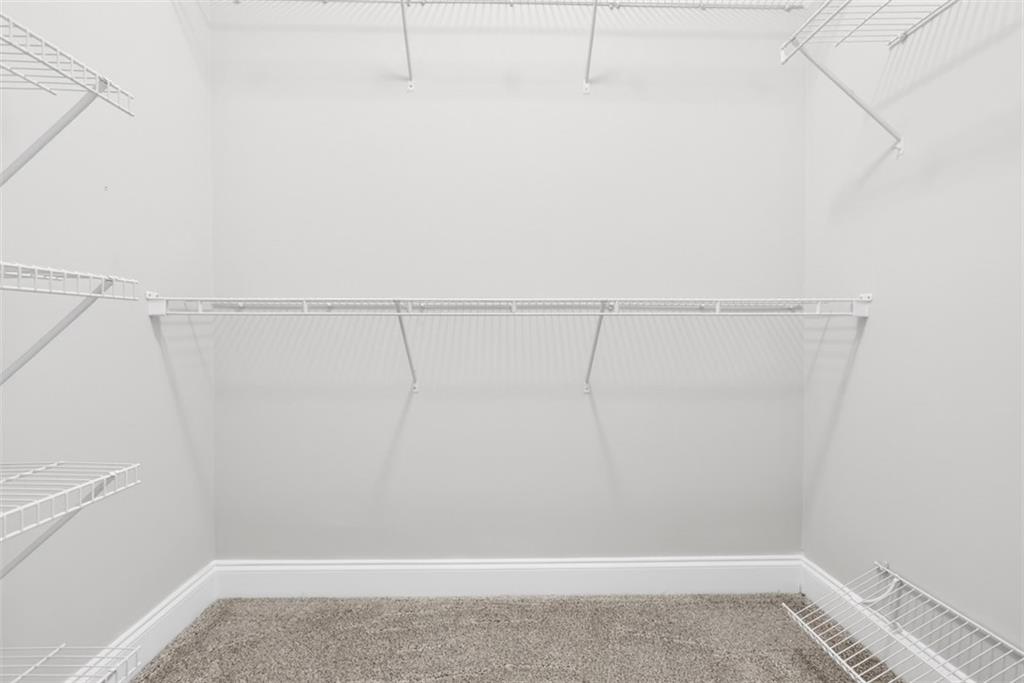 3570 Bulloch Lake Road Loganville, GA 30052 - Photo 27 of 71 a view of a room with racks on the wall