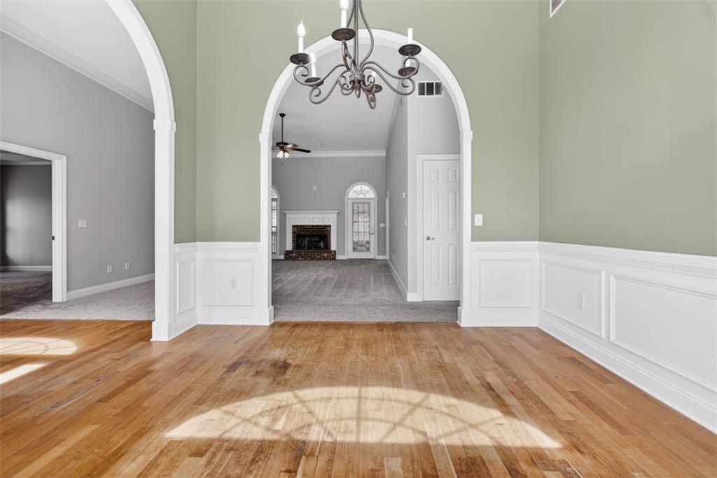 3570 Bulloch Lake Road Loganville, GA 30052 - Photo 4 of 71 a view of a hallway with wooden floor