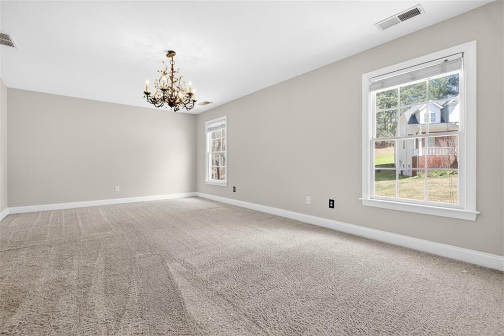 3570 Bulloch Lake Road Loganville, GA 30052 - Photo 44 of 71 a view of a windows and chandelier in a room