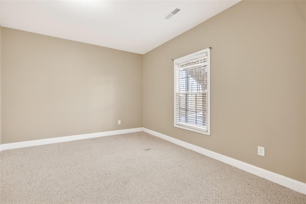3570 Bulloch Lake Road Loganville, GA 30052 - Photo 55 of 71 a view of an empty room with a window