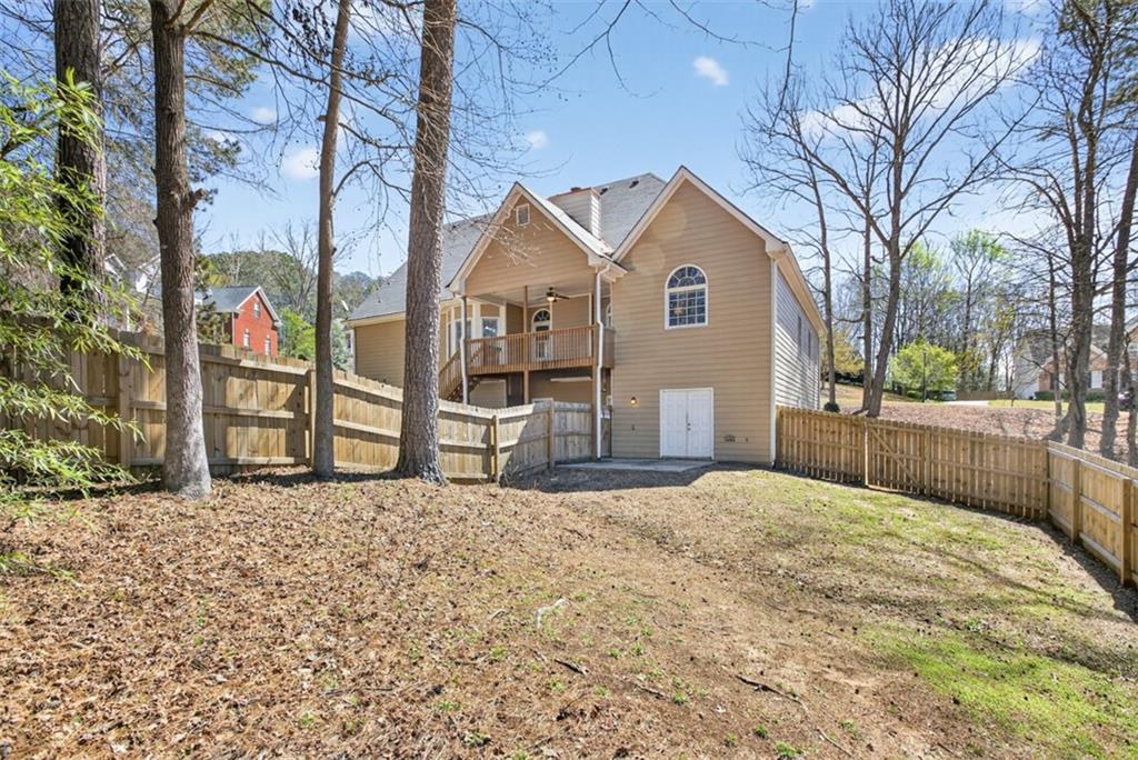 3570 Bulloch Lake Road Loganville, GA 30052 - Photo 67 of 71 a front view of a house with a yard covered in snow