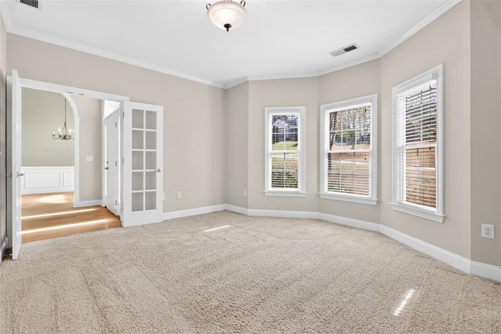 3570 Bulloch Lake Road Loganville, GA 30052 - Photo 7 of 71 an empty room with windows