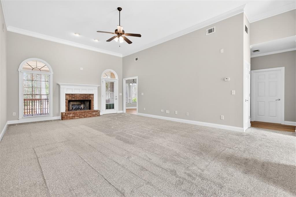 3570 Bulloch Lake Road Loganville, GA 30052 - Photo 8 of 71 a view of an empty room with a fireplace and a window