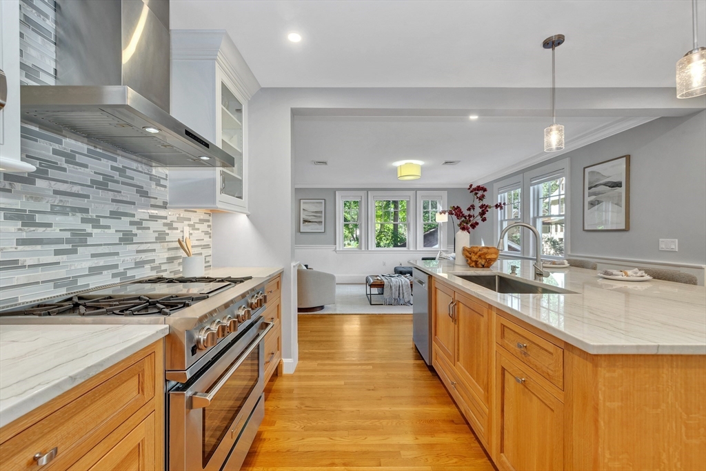 58 Bacon Street Winchester, MA 01890 - Photo 13 of 40 a kitchen with sink stove and cabinets