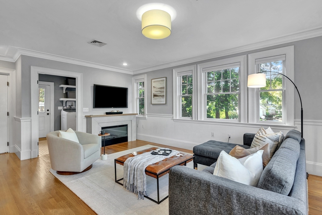 58 Bacon Street Winchester, MA 01890 - Photo 15 of 40 a living room with furniture and a flat screen tv
