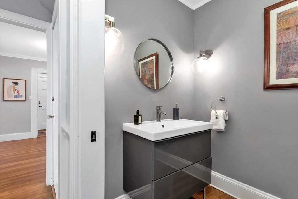 58 Bacon Street Winchester, MA 01890 - Photo 19 of 40 a bathroom with a sink and a mirror