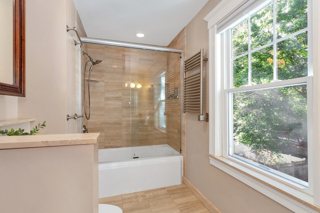 58 Bacon Street Winchester, MA 01890 - Photo 22 of 40 a bathroom with a sink mirror toilet and bathtub