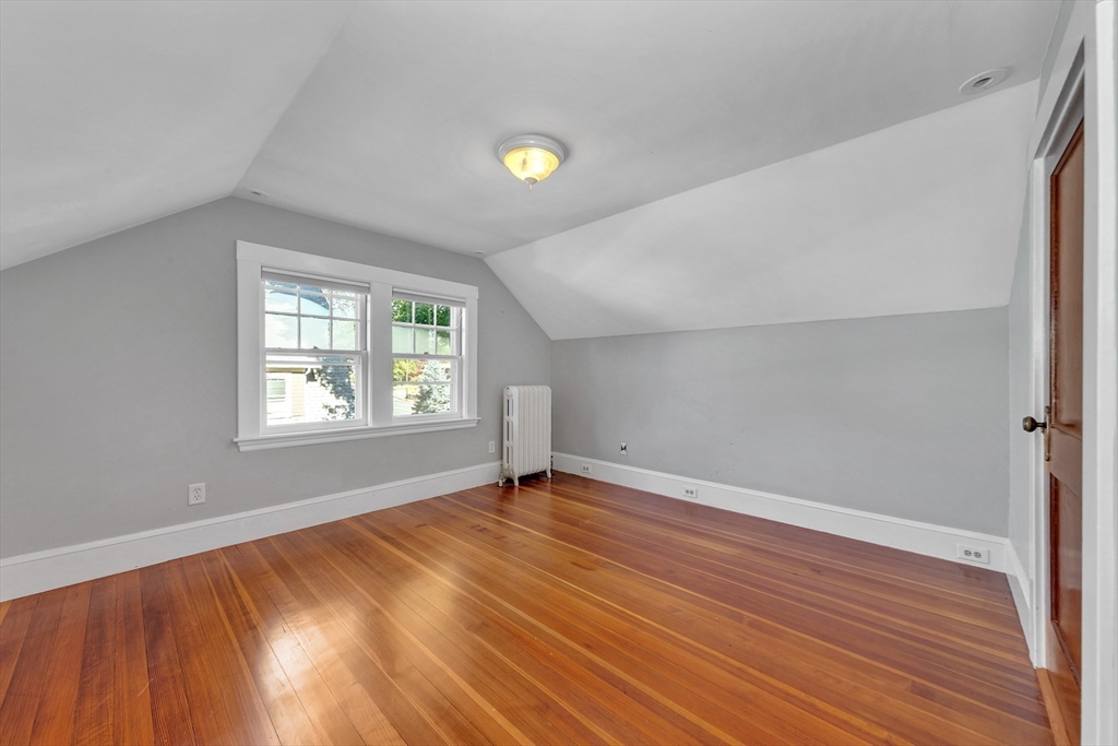 58 Bacon Street Winchester, MA 01890 - Photo 30 of 40 an empty room with wooden floor and windows