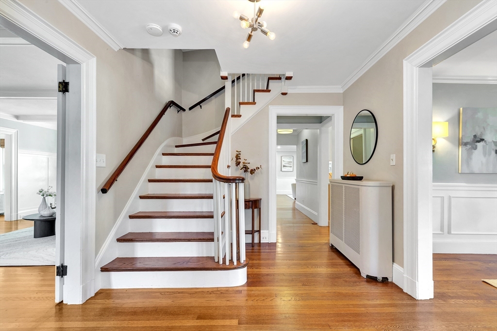 58 Bacon Street Winchester, MA 01890 - Photo 3 of 40 a view of a hallway with wooden floor and entryway