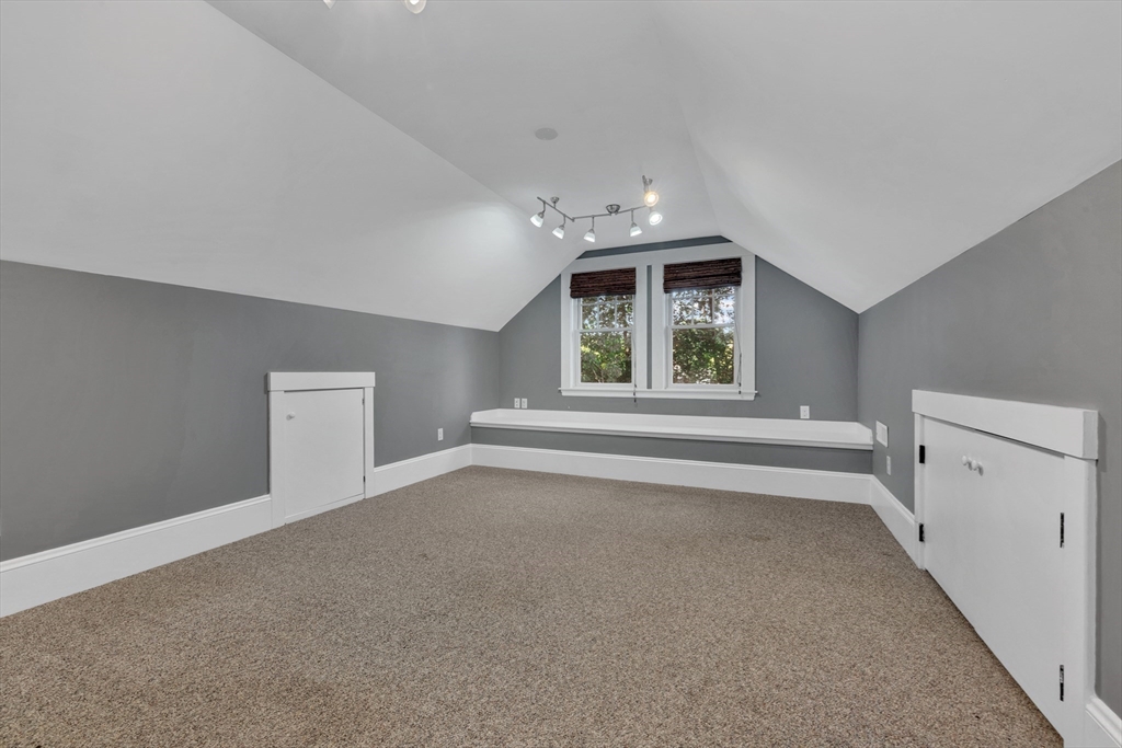 58 Bacon Street Winchester, MA 01890 - Photo 31 of 40 a view of an empty room with a window