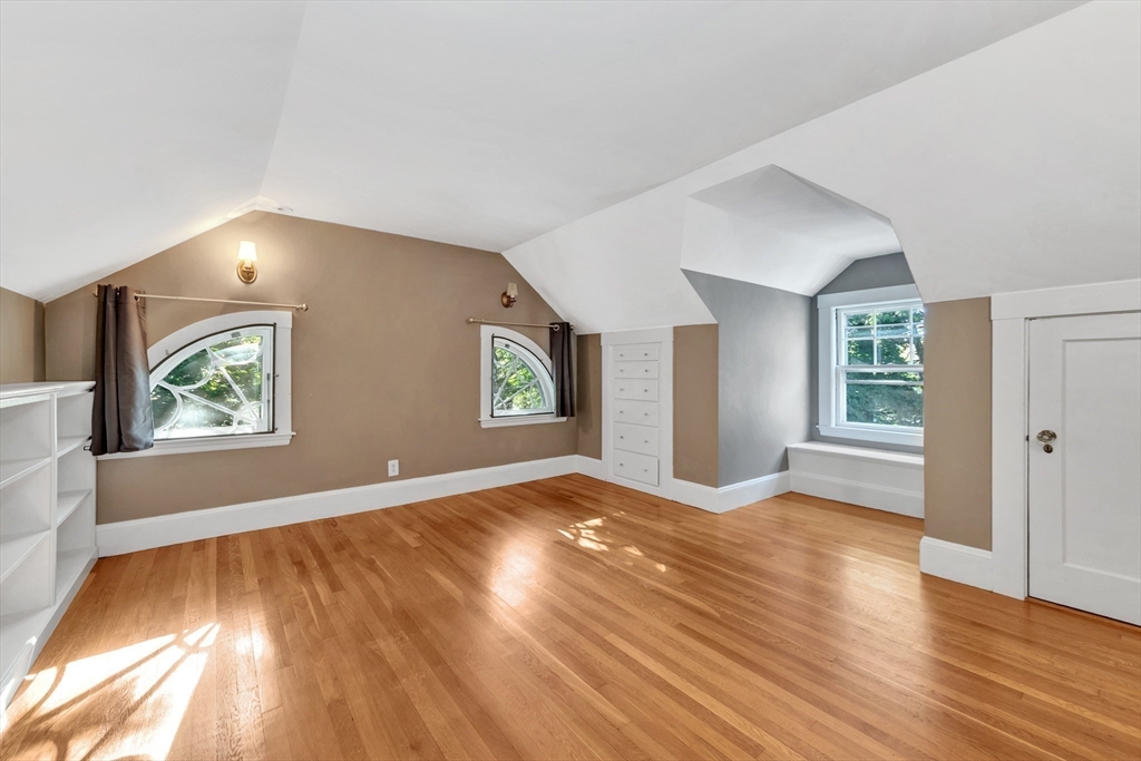 58 Bacon Street Winchester, MA 01890 - Photo 32 of 40 a view of livingroom with window and wooden floor