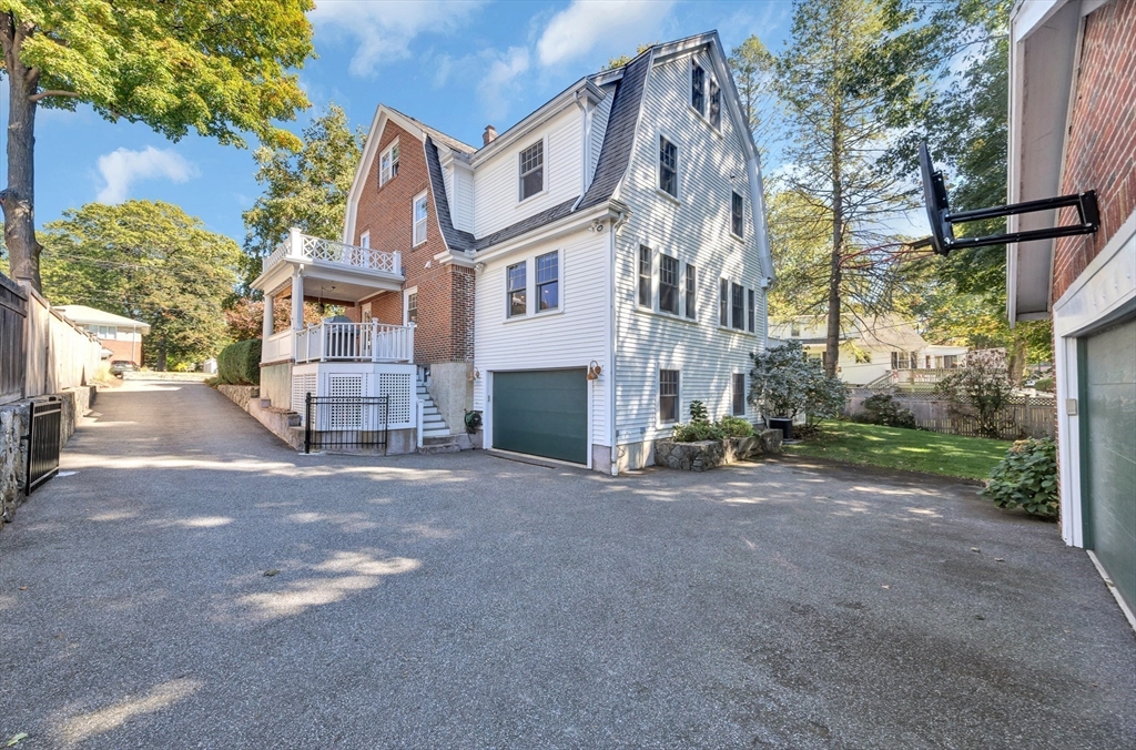 58 Bacon Street Winchester, MA 01890 - Photo 35 of 40 a view of a street with buildings