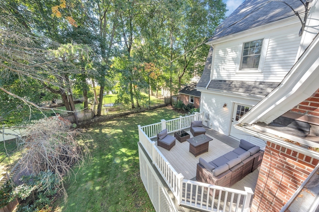58 Bacon Street Winchester, MA 01890 - Photo 37 of 40 a view of an house with backyard porch and furniture