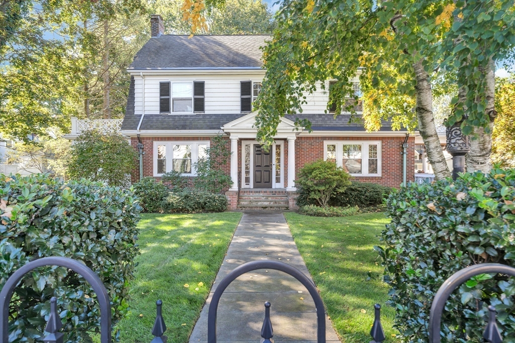 58 Bacon Street Winchester, MA 01890 - Photo 40 of 40 front view of a house with a yard