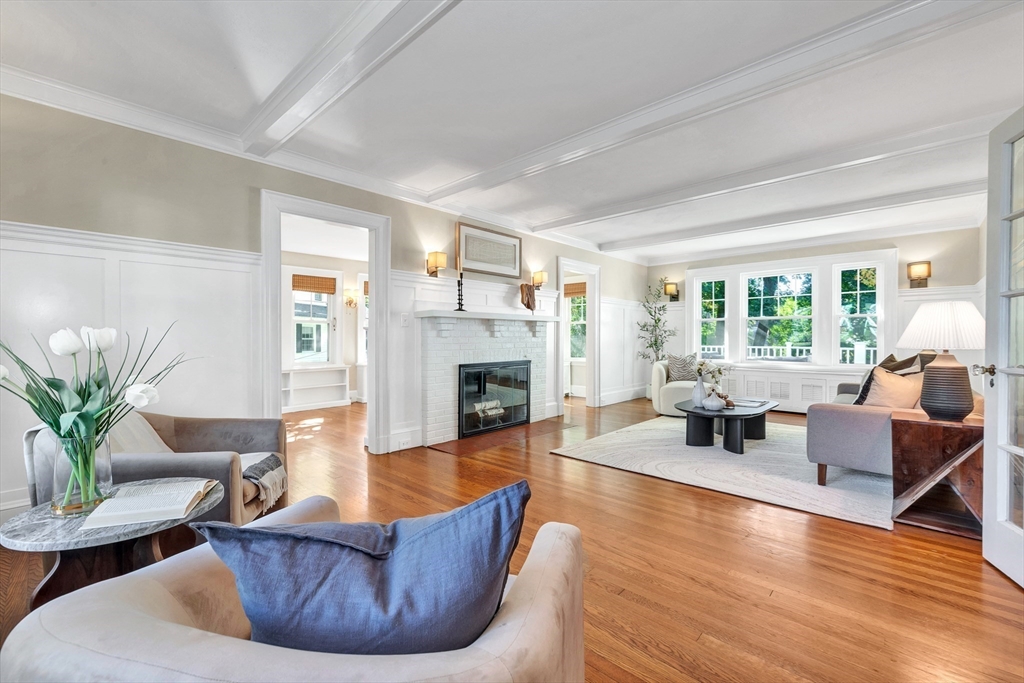 58 Bacon Street Winchester, MA 01890 - Photo 5 of 40 a living room with furniture large window and a fireplace