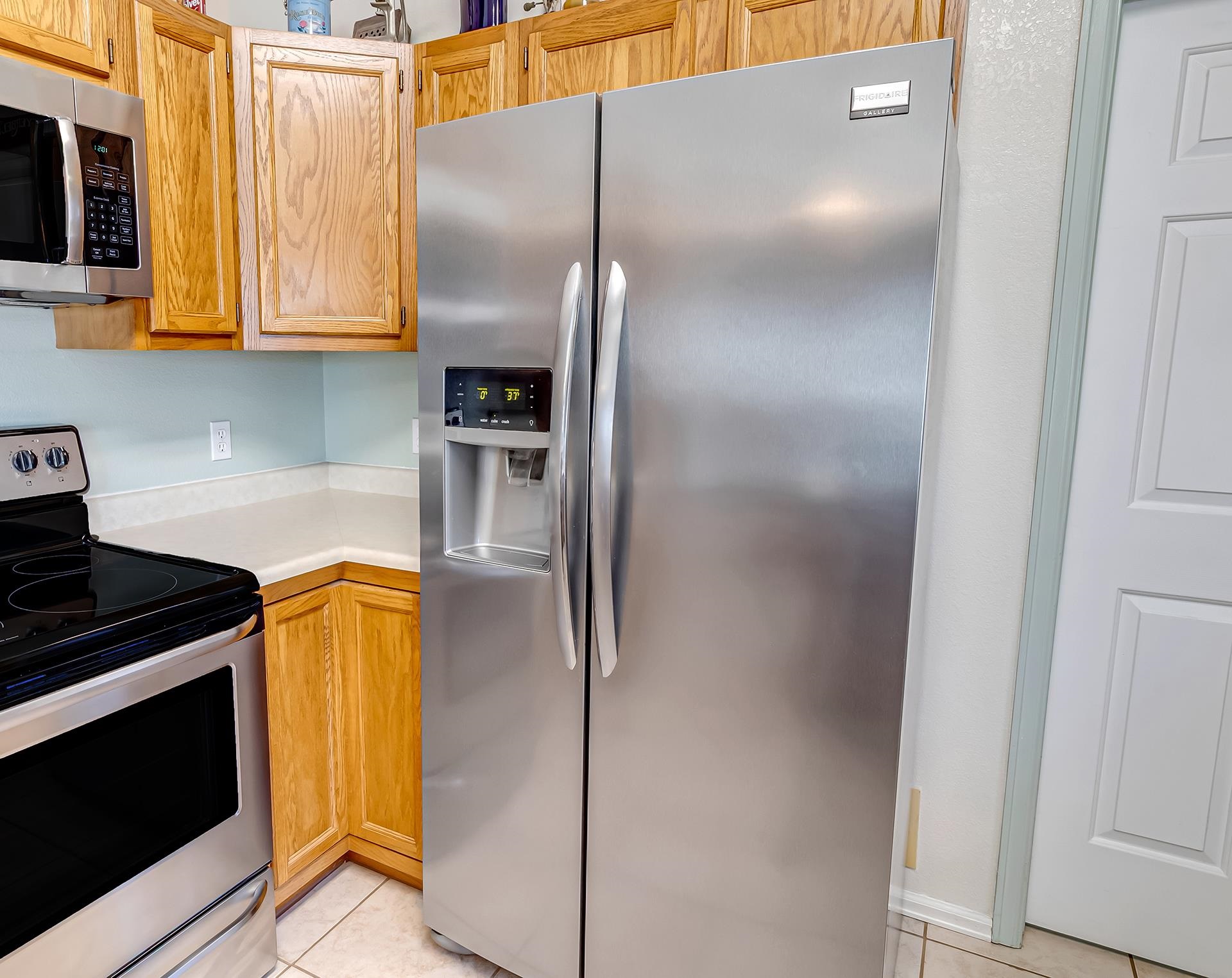 110 Sunset Drive Fruita, CO 81521 - Photo 14 of 39 a kitchen with stainless steel appliances granite countertop a refrigerator a stove and a microwave