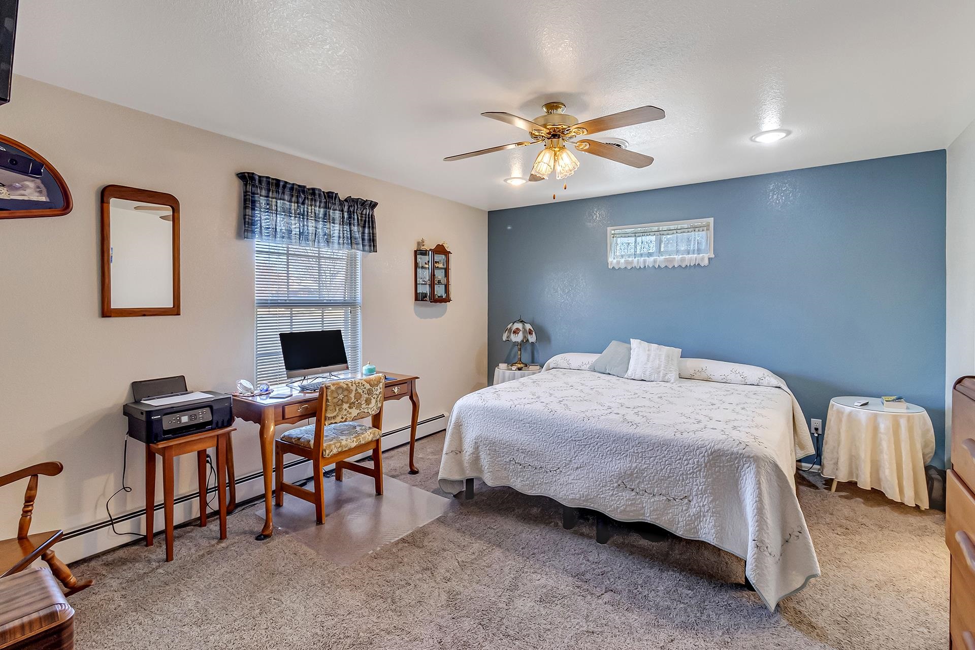110 Sunset Drive Fruita, CO 81521 - Photo 18 of 39 a bedroom with a bed work place and a desk