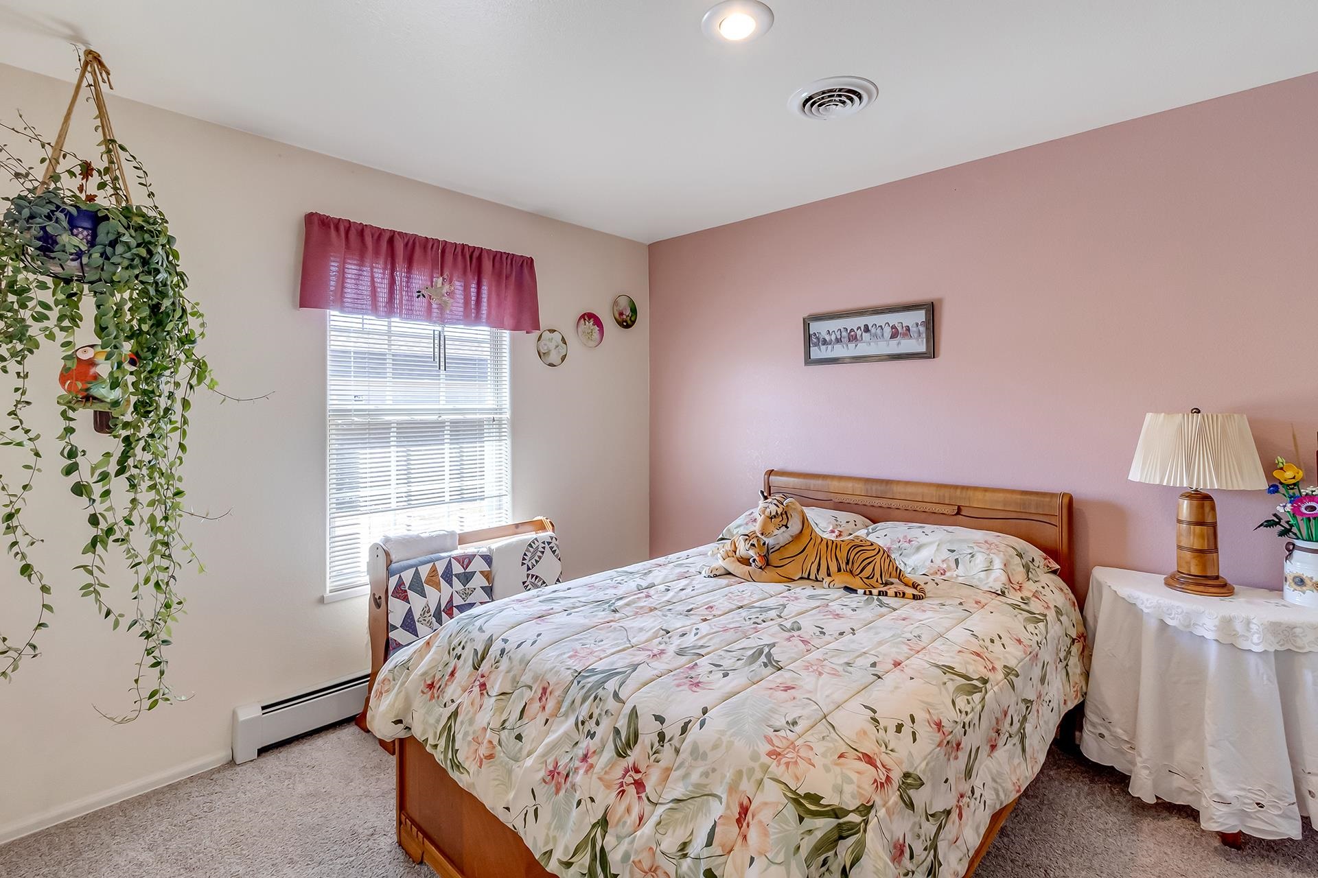 110 Sunset Drive Fruita, CO 81521 - Photo 23 of 39 a bedroom with a bed and a window