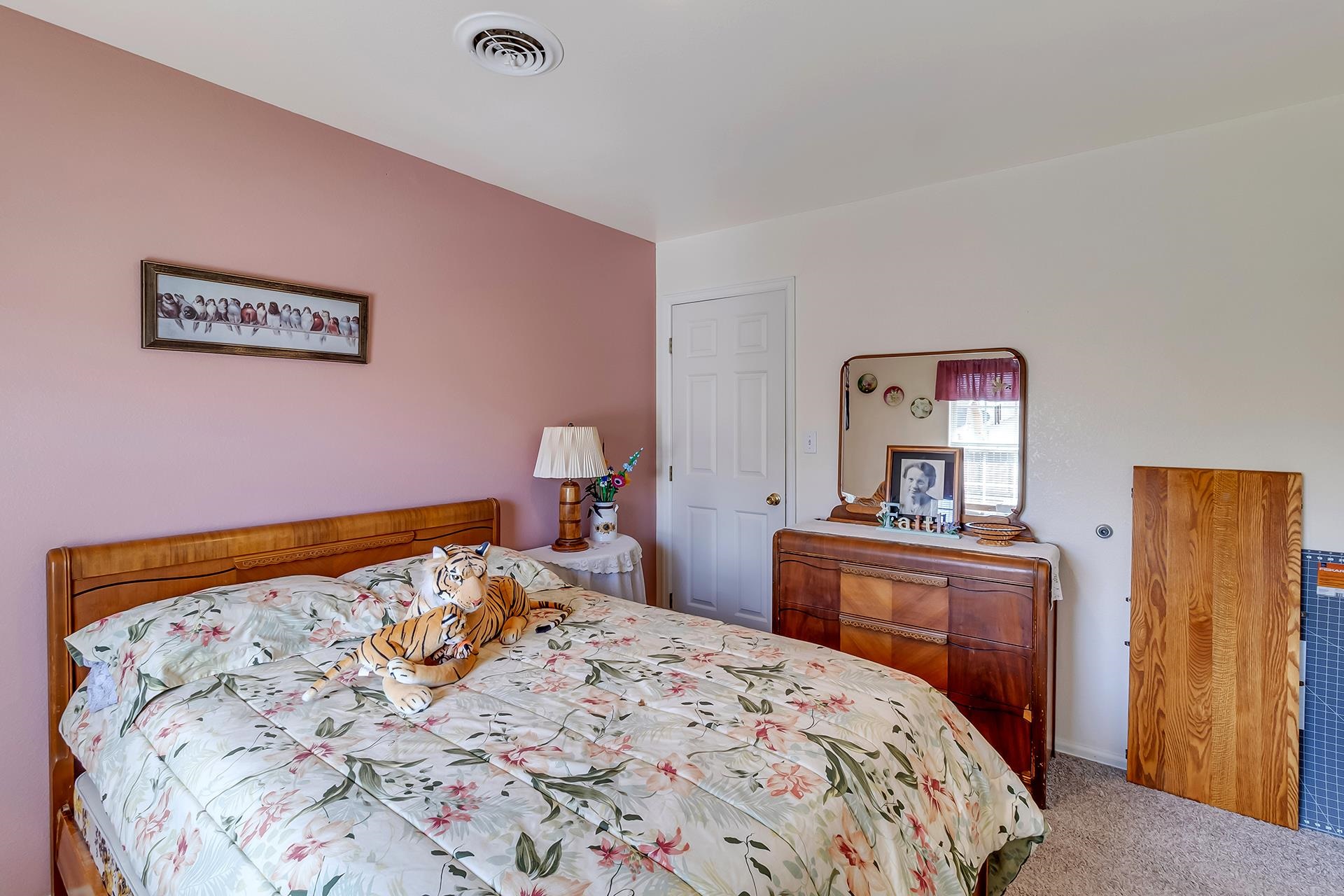 110 Sunset Drive Fruita, CO 81521 - Photo 24 of 39 a bedroom with a bed and painting on the wall