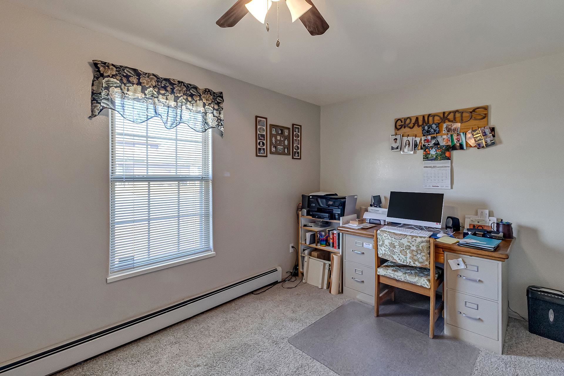 110 Sunset Drive Fruita, CO 81521 - Photo 28 of 39 a view of a workspace with furniture and a window