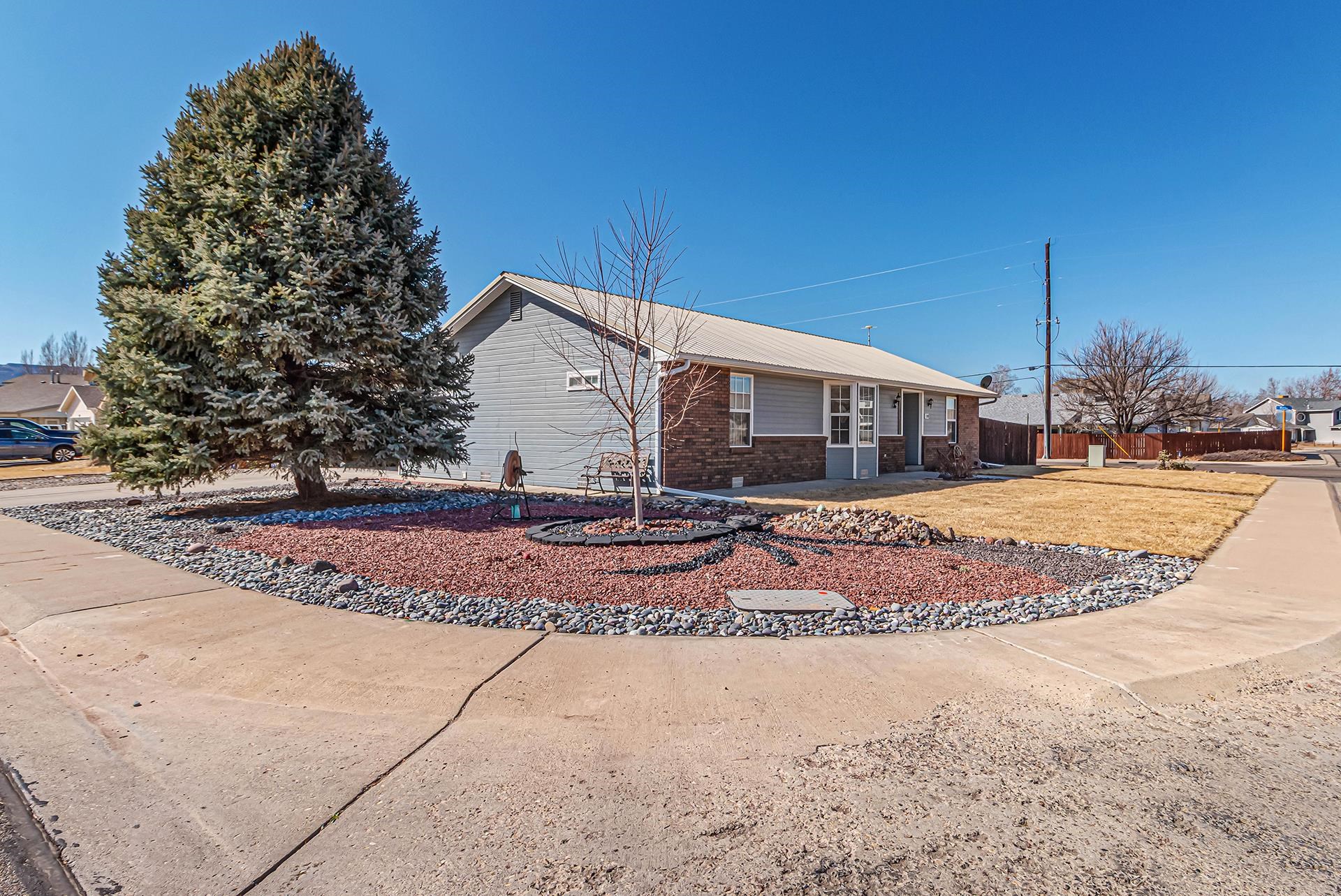 110 Sunset Drive Fruita, CO 81521 - Photo 3 of 39 a view of a house with entertaining space